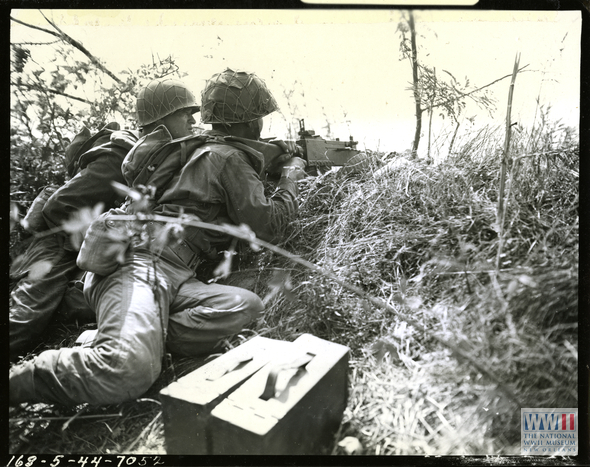 A Light Machine Gun Crew Provides Covering Fire For Troops Of The 422nd 